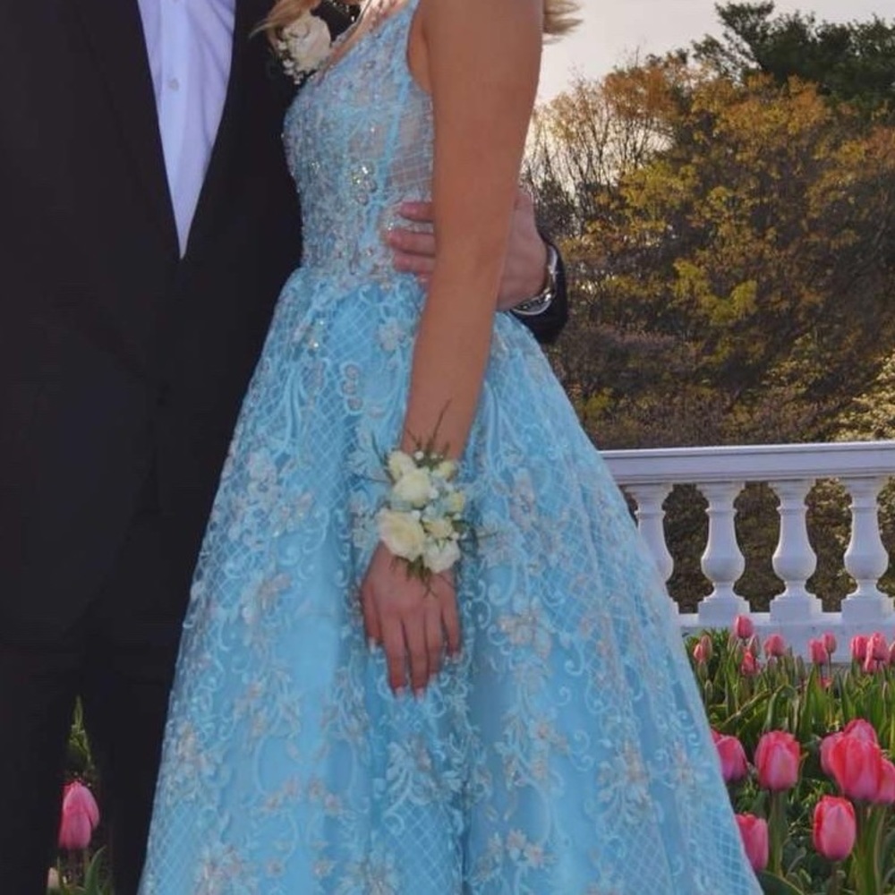 This is a beautiful one of a kind dress with baby blue and hints of silver.